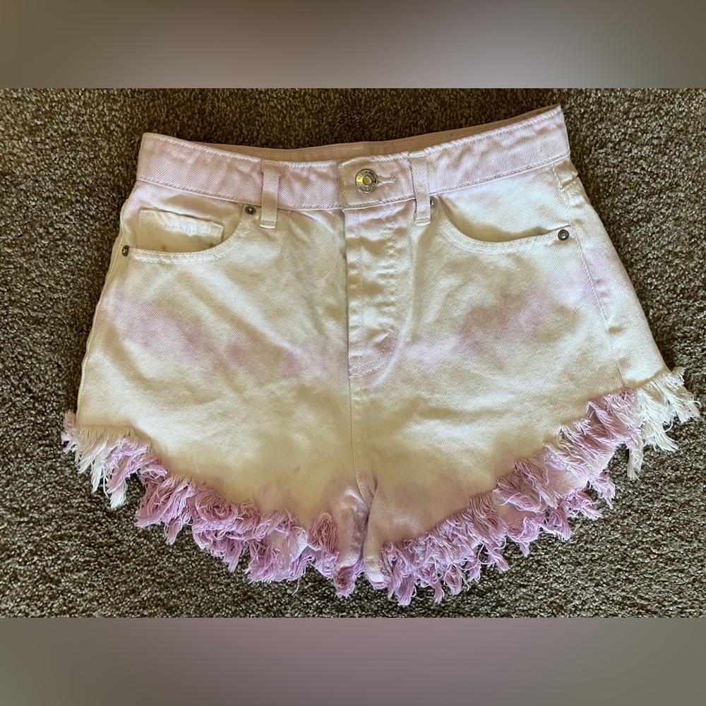 Purple and white tie-dyed denim shorts with raw hem